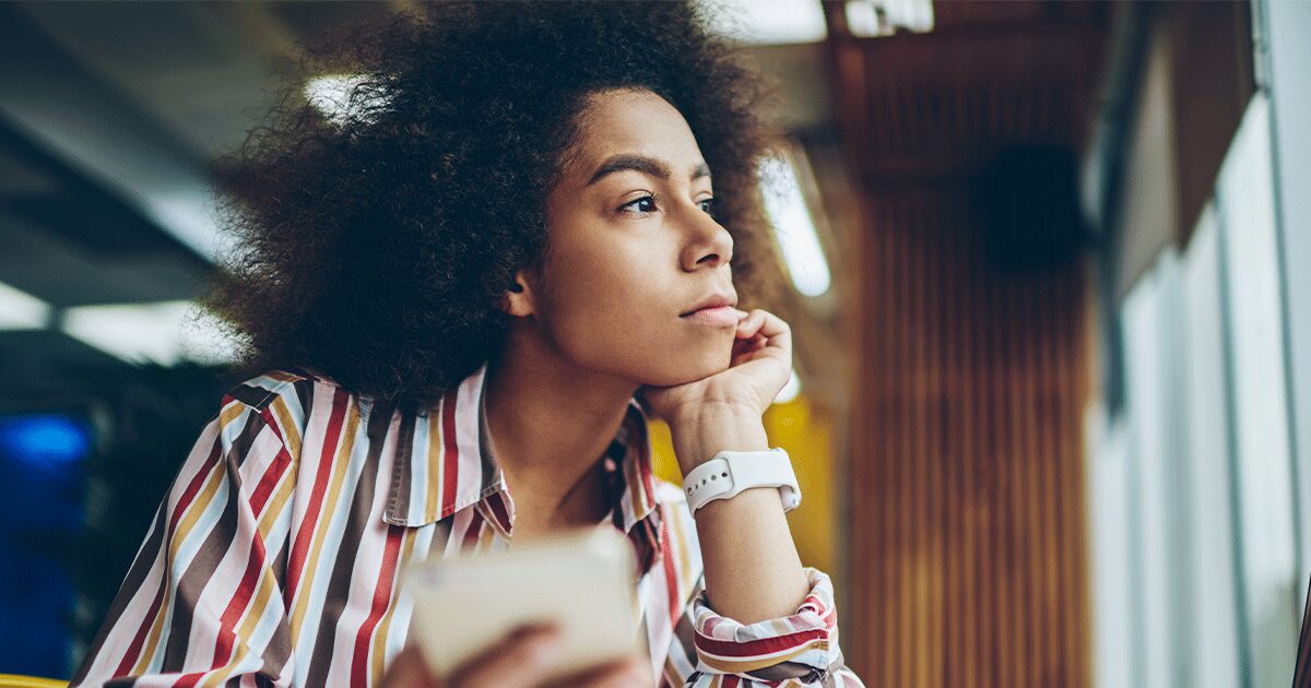 A woman thinking about common abortion symptoms