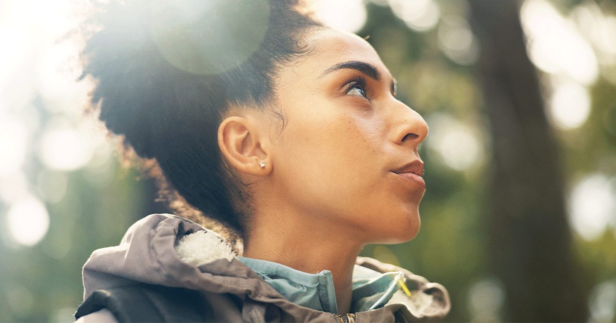 A thoughtful woman considers the differences between open, semi-open, and closed adoption.