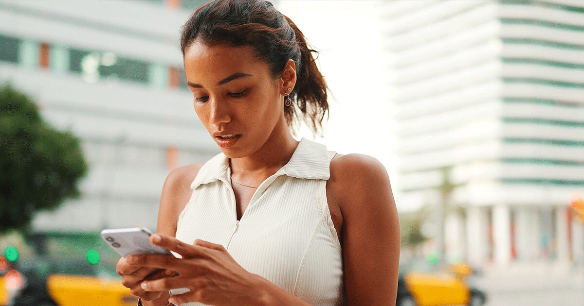 Woman searching for guidance on her phone after birth control failed.